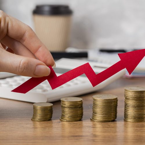 hand-holding-growth-arrow-with-coins
